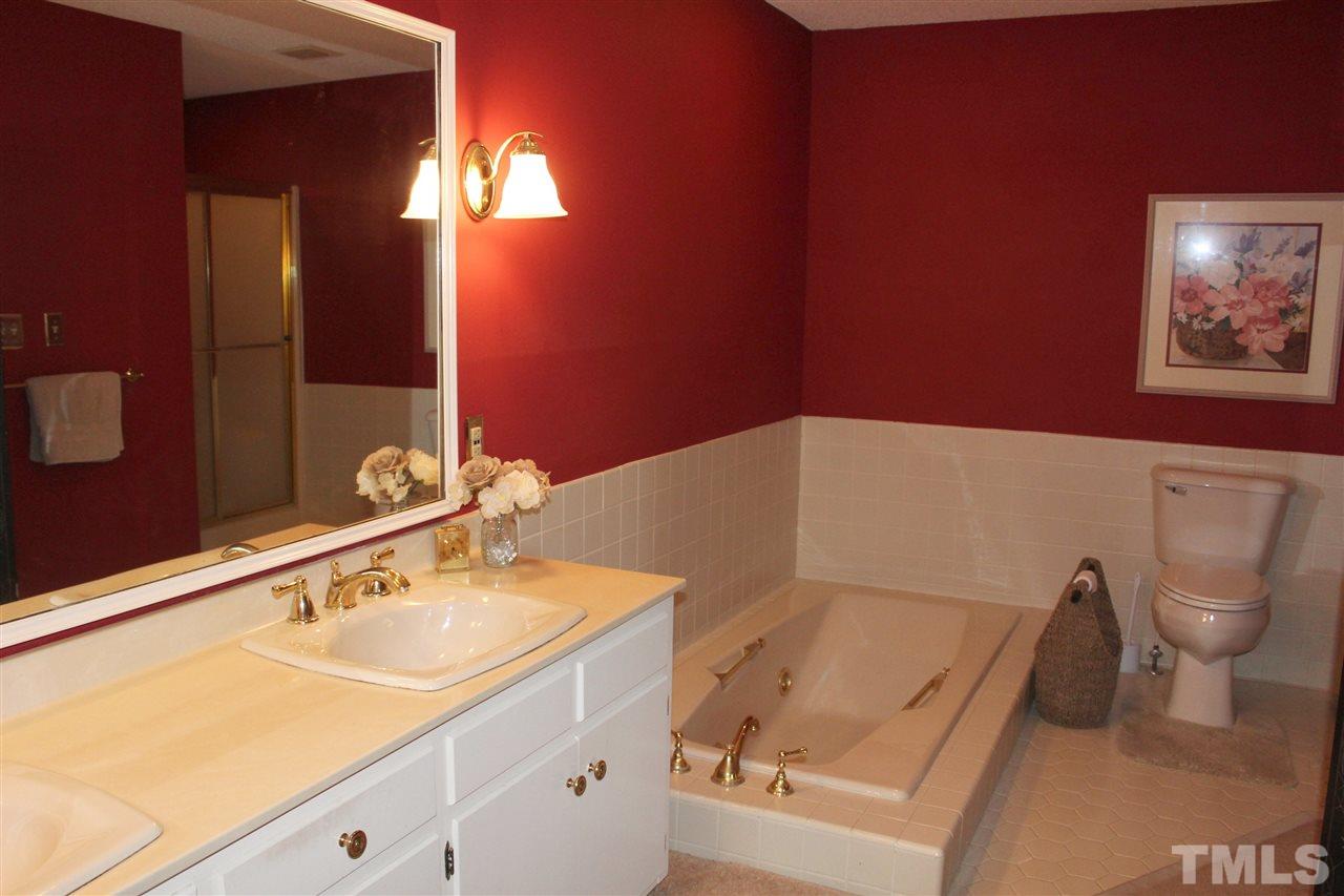 1502 Rogers Road Graham, NC 27253 - Photo 15 of 25 Master bath has double vanity and jetted tub plus separate shower.