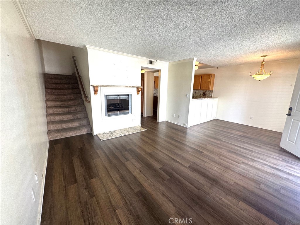 8939 Gallatin Road, Unit 16 Pico Rivera, CA 90660 - Photo 4 of 17 LIVING TO FIREPLACE