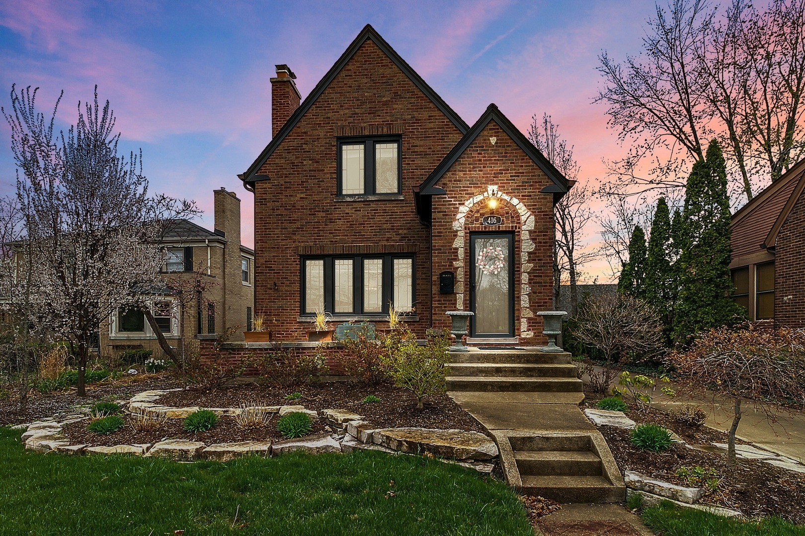 416 Loudon Road Riverside, IL 60546 - Photo 1 of 36 a front view of a house with a yard