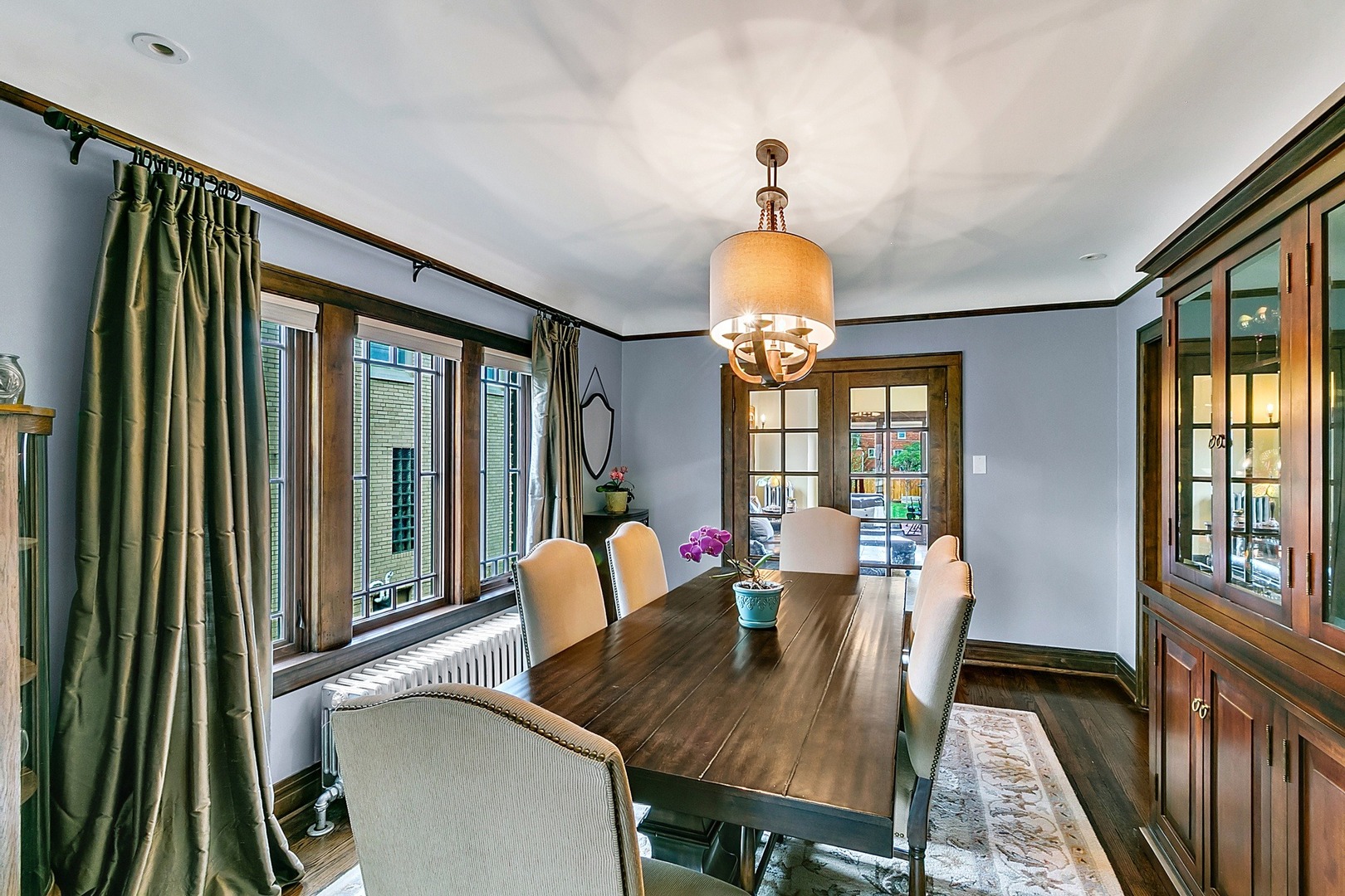 416 Loudon Road Riverside, IL 60546 - Photo 5 of 36 a view of a dining room with furniture a chandelier and wooden floor