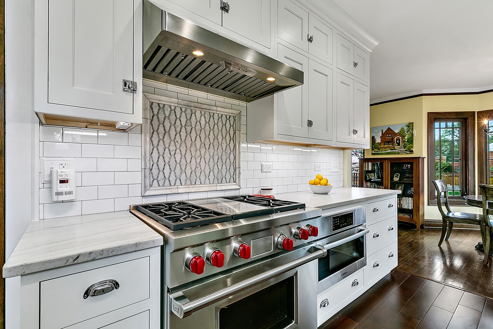 416 Loudon Road Riverside, IL 60546 - Photo 10 of 36 a kitchen with granite countertop a stove and a wooden cabinets