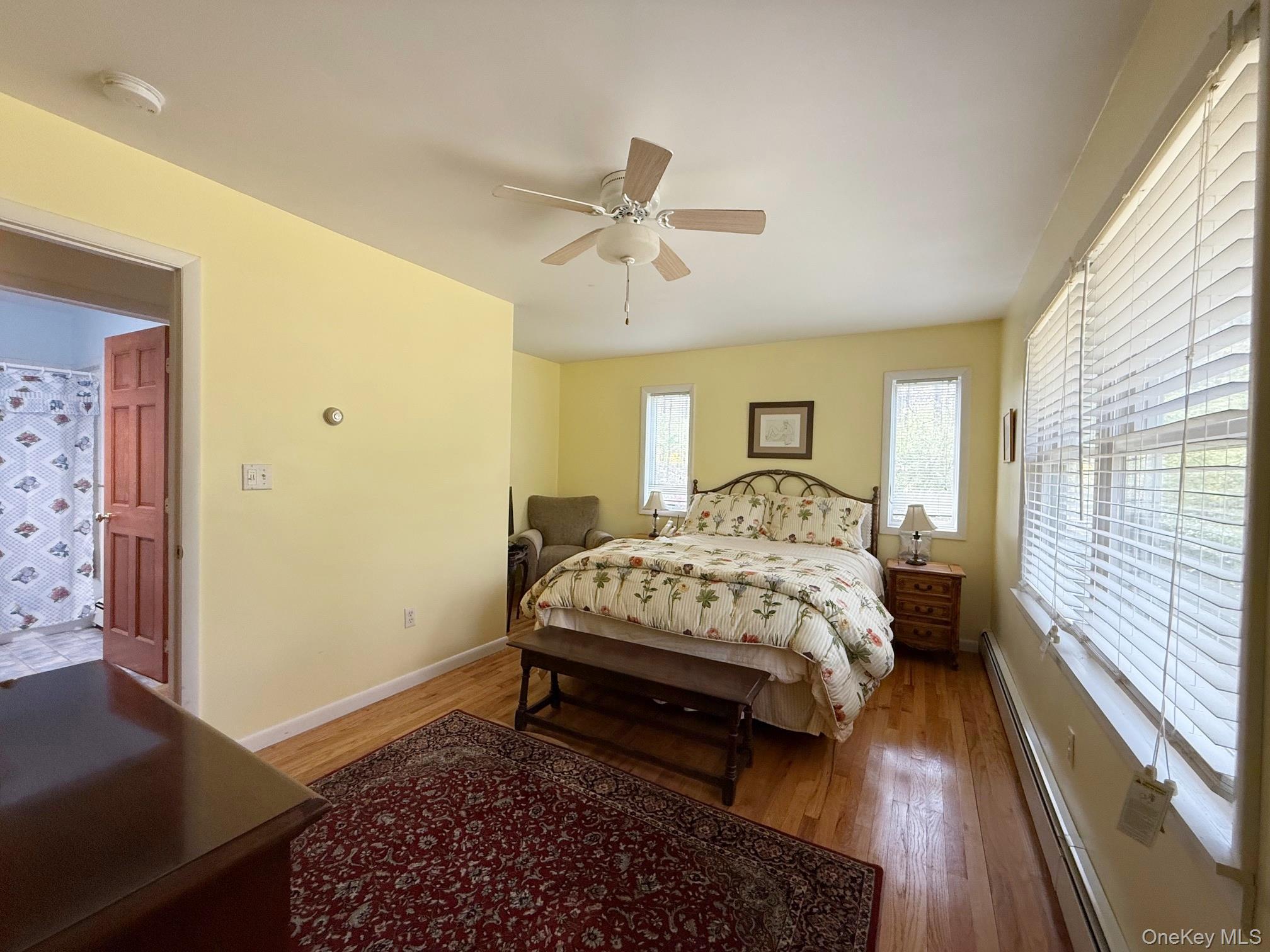 230 Cooper Road Millerton, NY 12546 - Photo 13 of 20 a bed sitting in a spacious bedroom next to a window