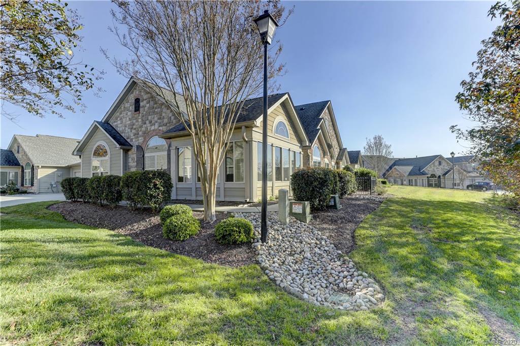 830 Ledgestone Court Tega Cay, SC 29708 - Photo 2 of 47 a front view of a house with garden