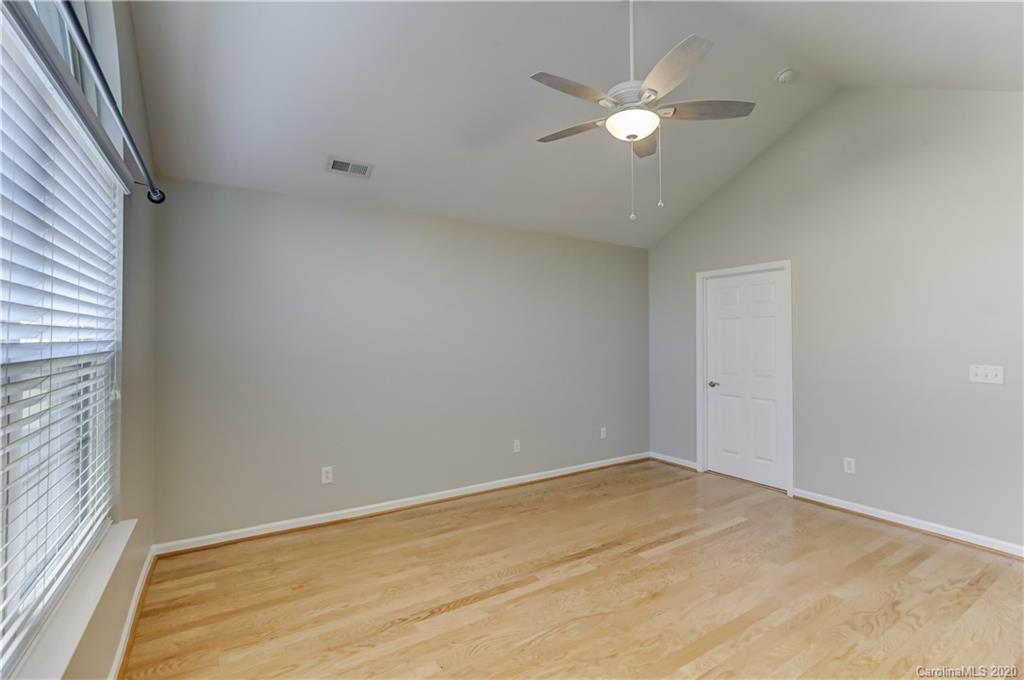 830 Ledgestone Court Tega Cay, SC 29708 - Photo 32 of 47 wooden floor in an empty room with a window