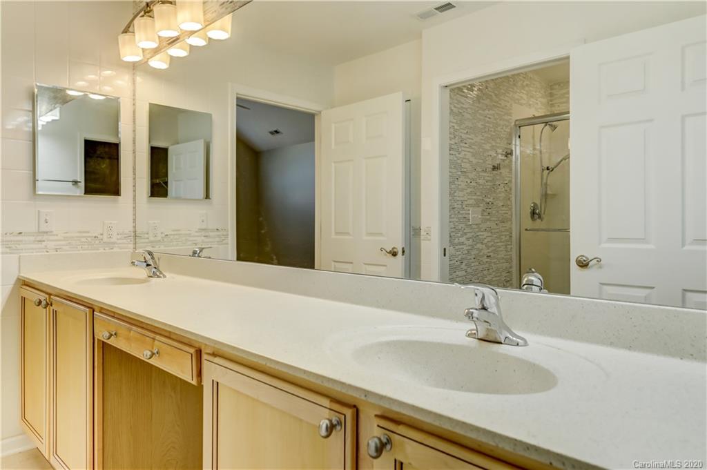 830 Ledgestone Court Tega Cay, SC 29708 - Photo 36 of 47 a bathroom with a sink and a mirror
