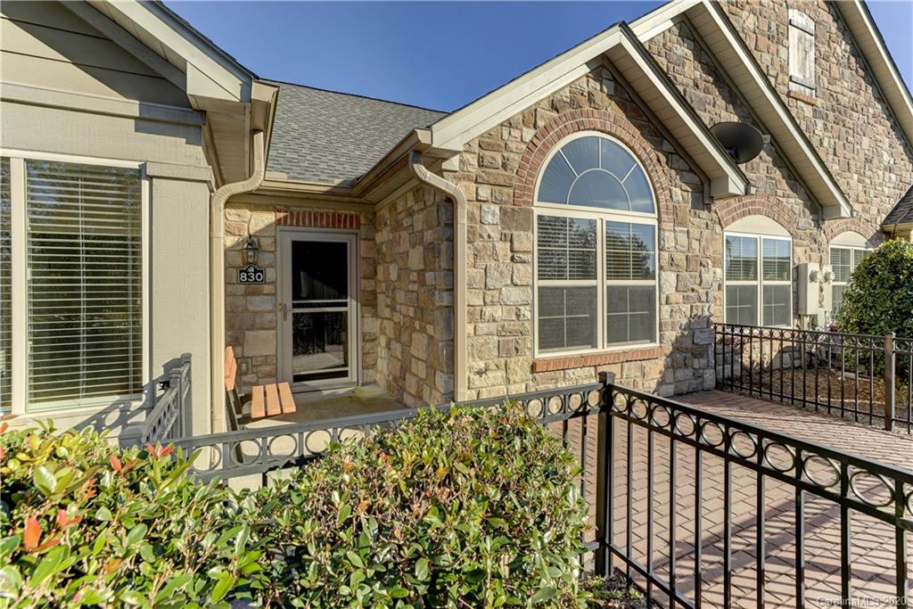830 Ledgestone Court Tega Cay, SC 29708 - Photo 5 of 47 a view of a brick house with large windows