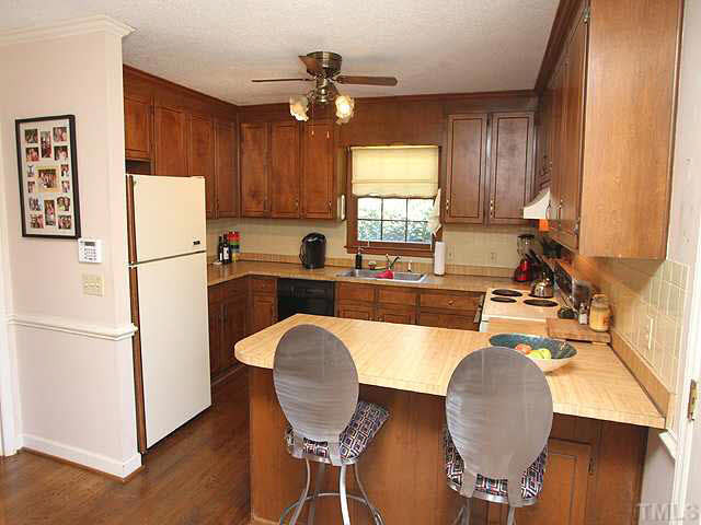 7904 Netherlands Drive Raleigh, NC 27606 - Photo 5 of 15 Excellent design with ample cabinets and counters. Pantry not pictured. Kitchen