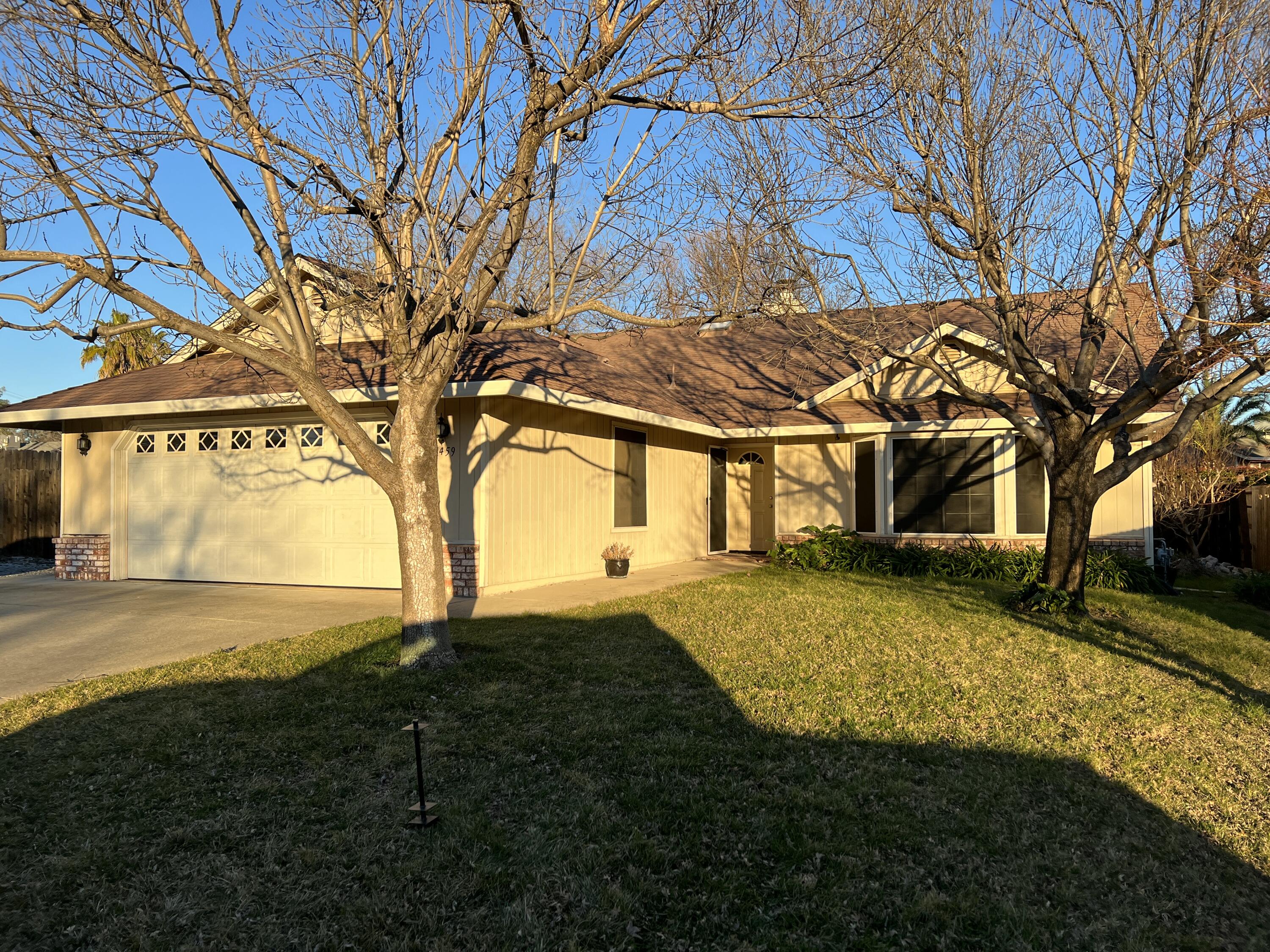 1459 Hominy Way Redding, CA 96003 - Photo 1 of 10 a view of back yard of the house with green space