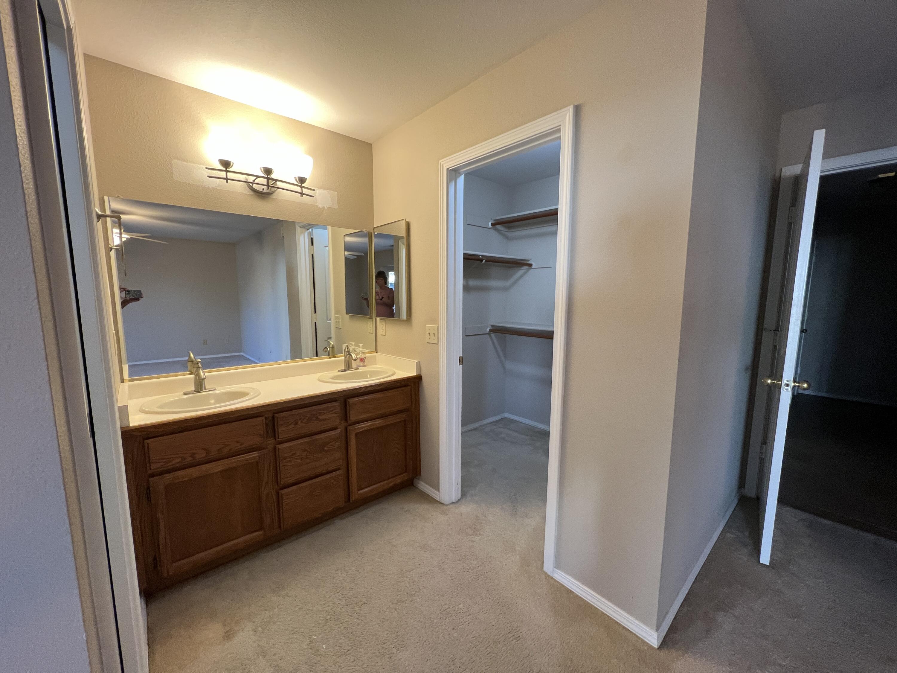 1459 Hominy Way Redding, CA 96003 - Photo 8 of 10 a bathroom with a double vanity sink and mirror