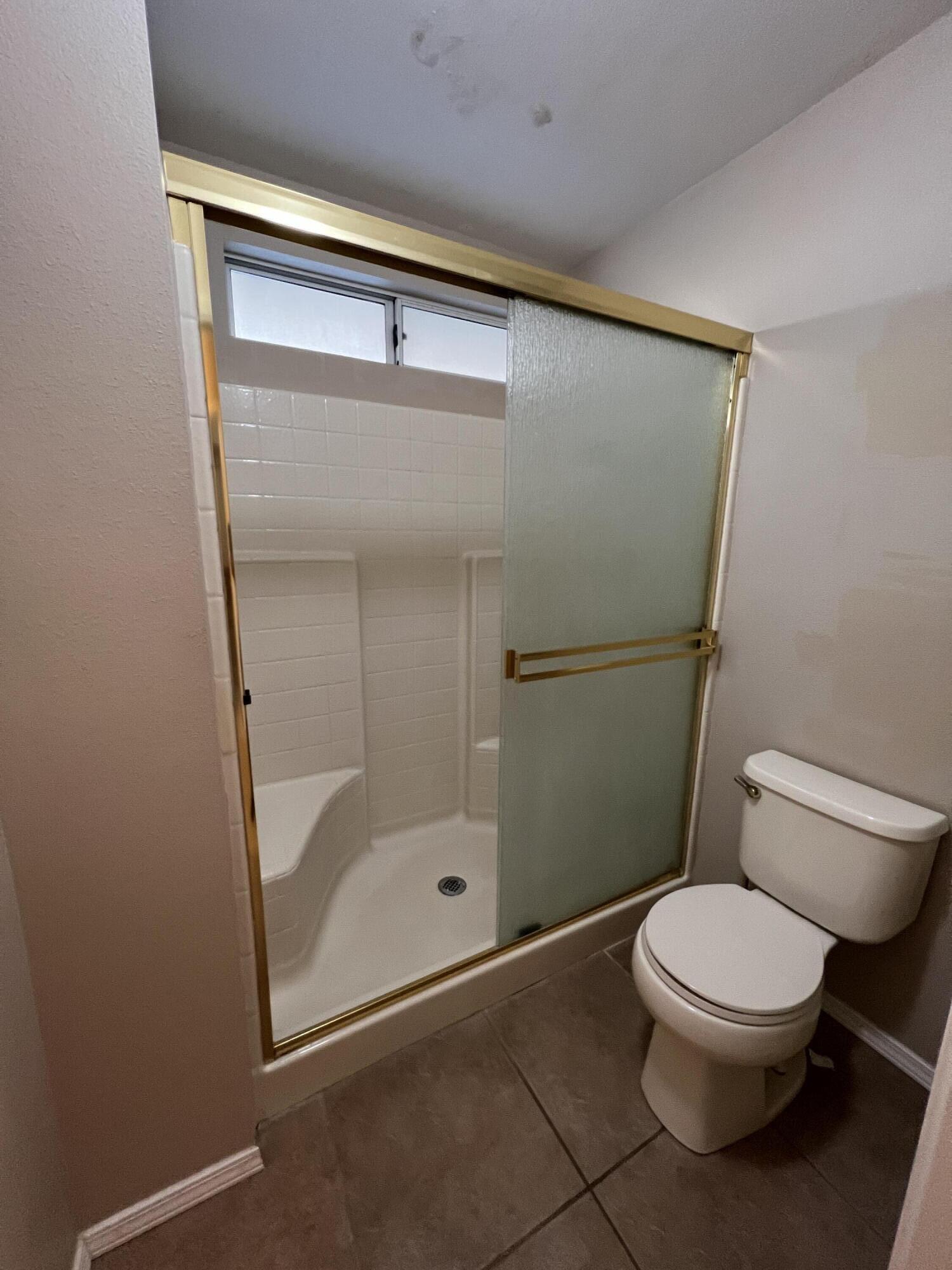 1459 Hominy Way Redding, CA 96003 - Photo 9 of 10 a white toilet sitting next to a bathroom sink