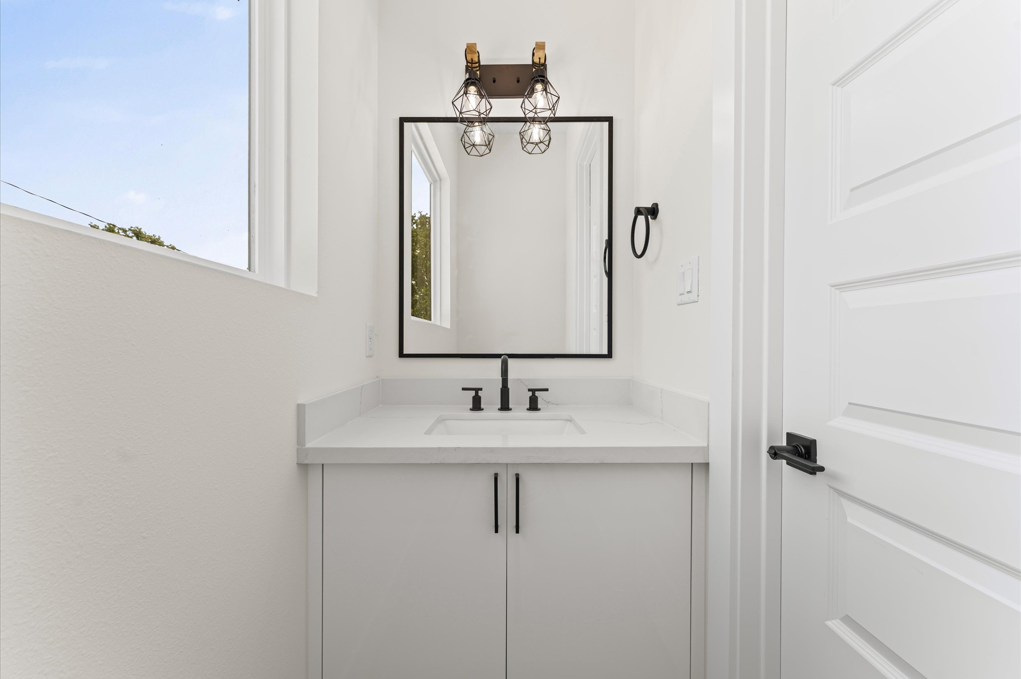 4104 Alice Street Houston, TX 77021 - Photo 19 of 28 a bathroom with a sink and a mirror