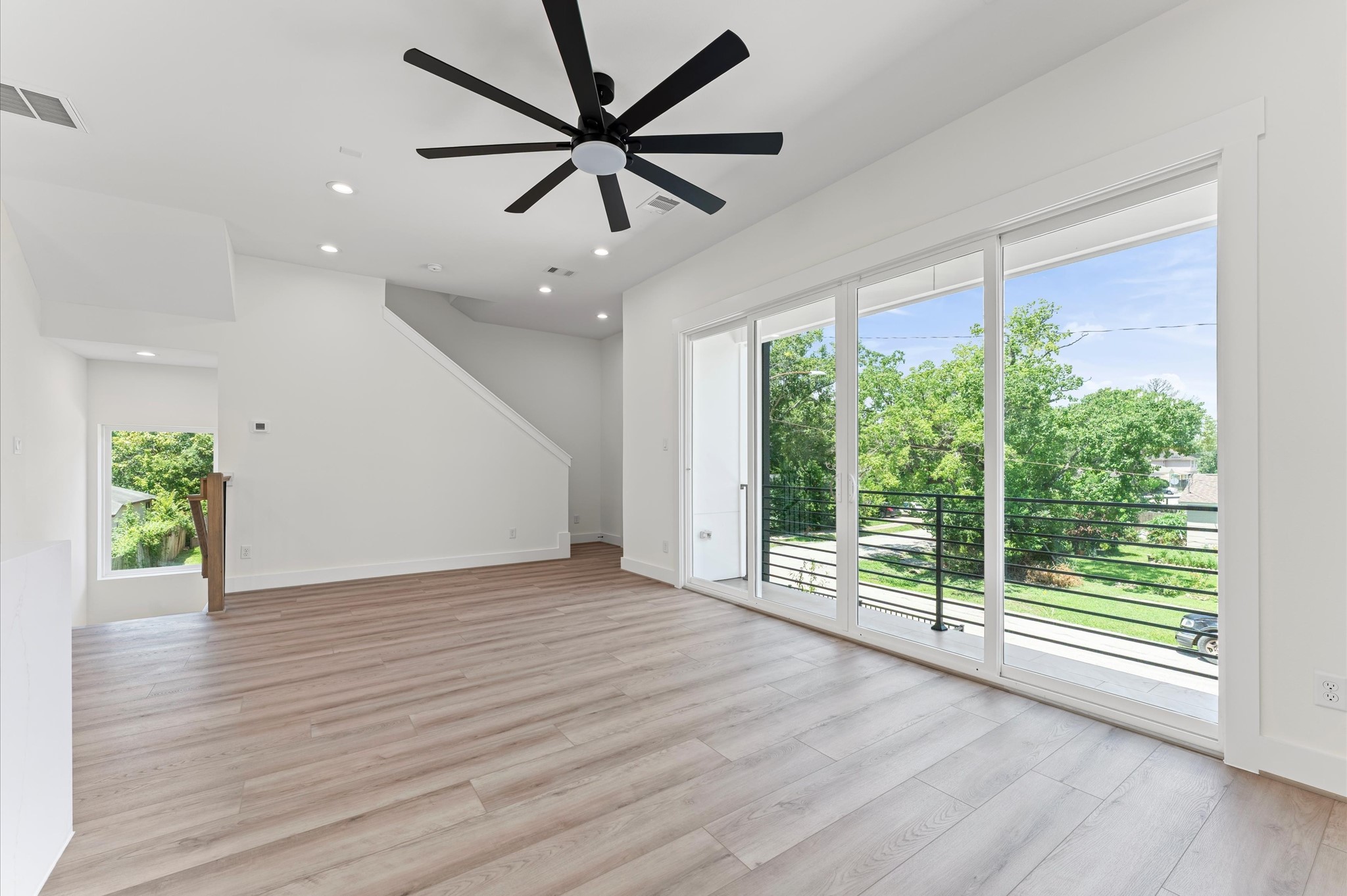 4104 Alice Street Houston, TX 77021 - Photo 21 of 28 a view of an empty room with wooden floor and a window