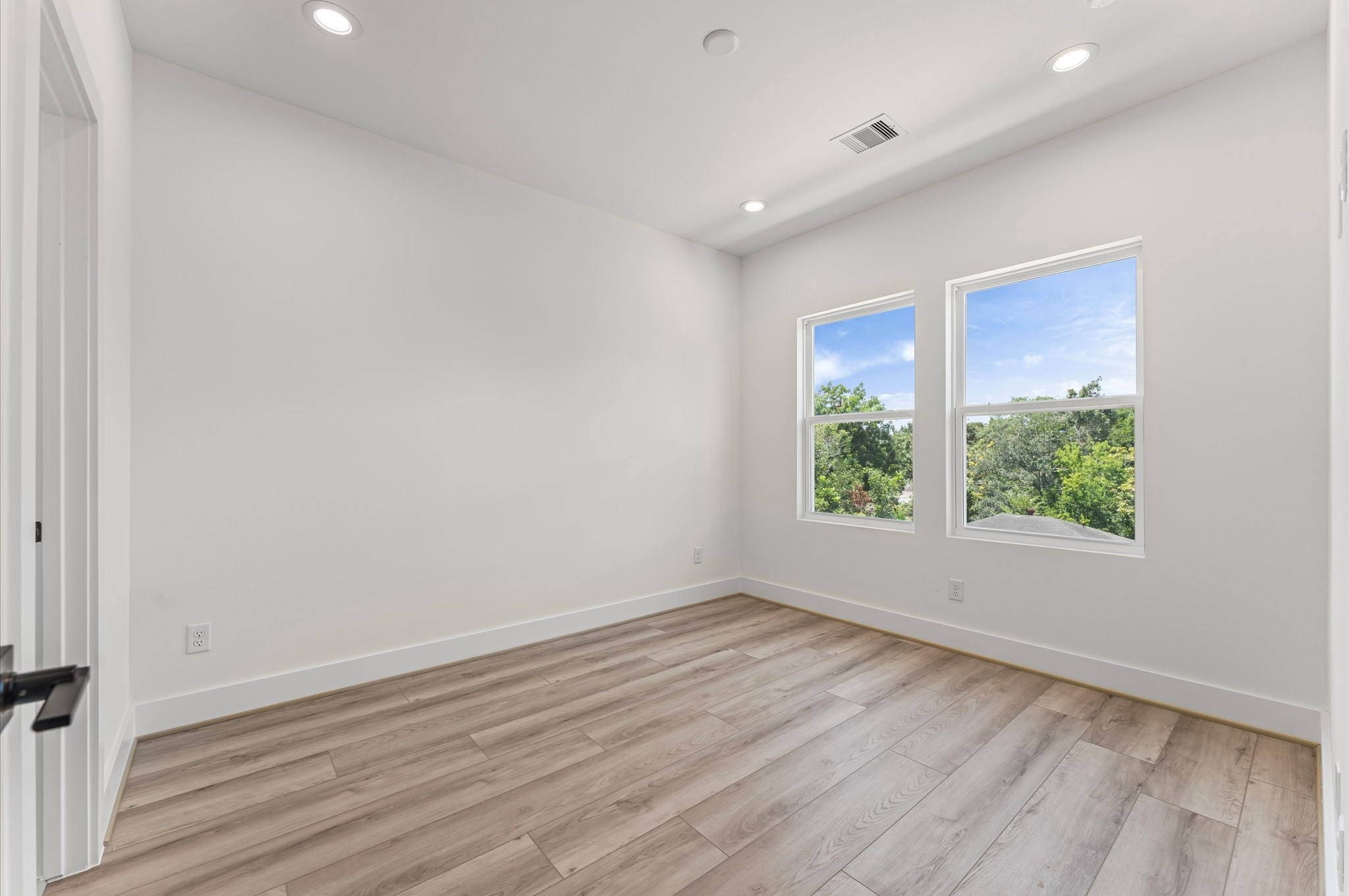 4104 Alice Street Houston, TX 77021 - Photo 24 of 28 wooden floor in an empty room with a window