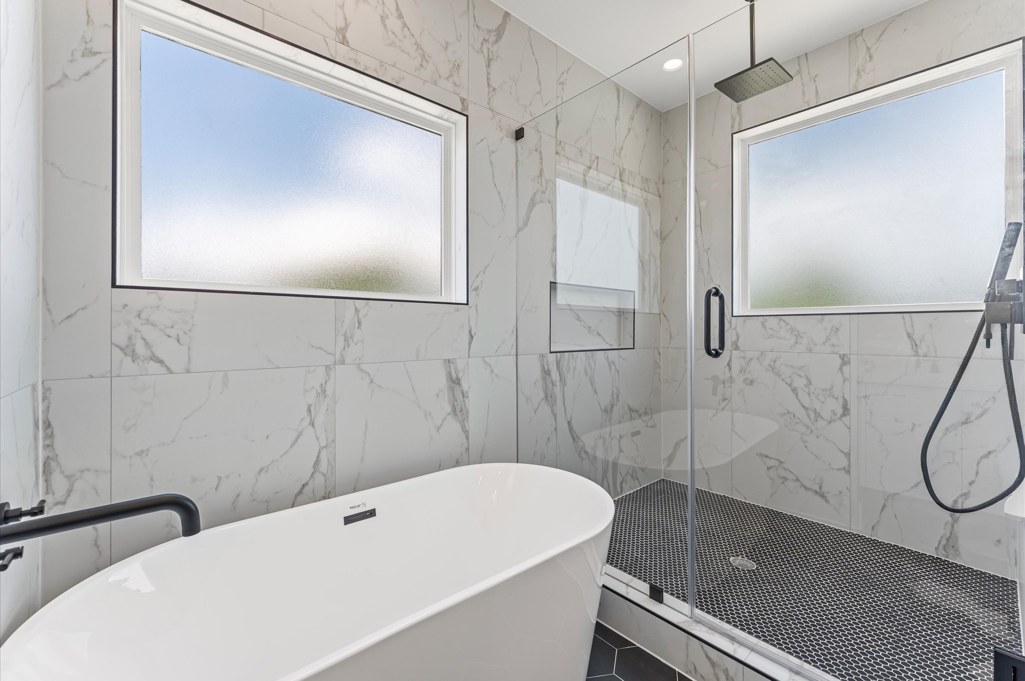 4104 Alice Street Houston, TX 77021 - Photo 28 of 28 a bathroom with a white bath tub and a shower