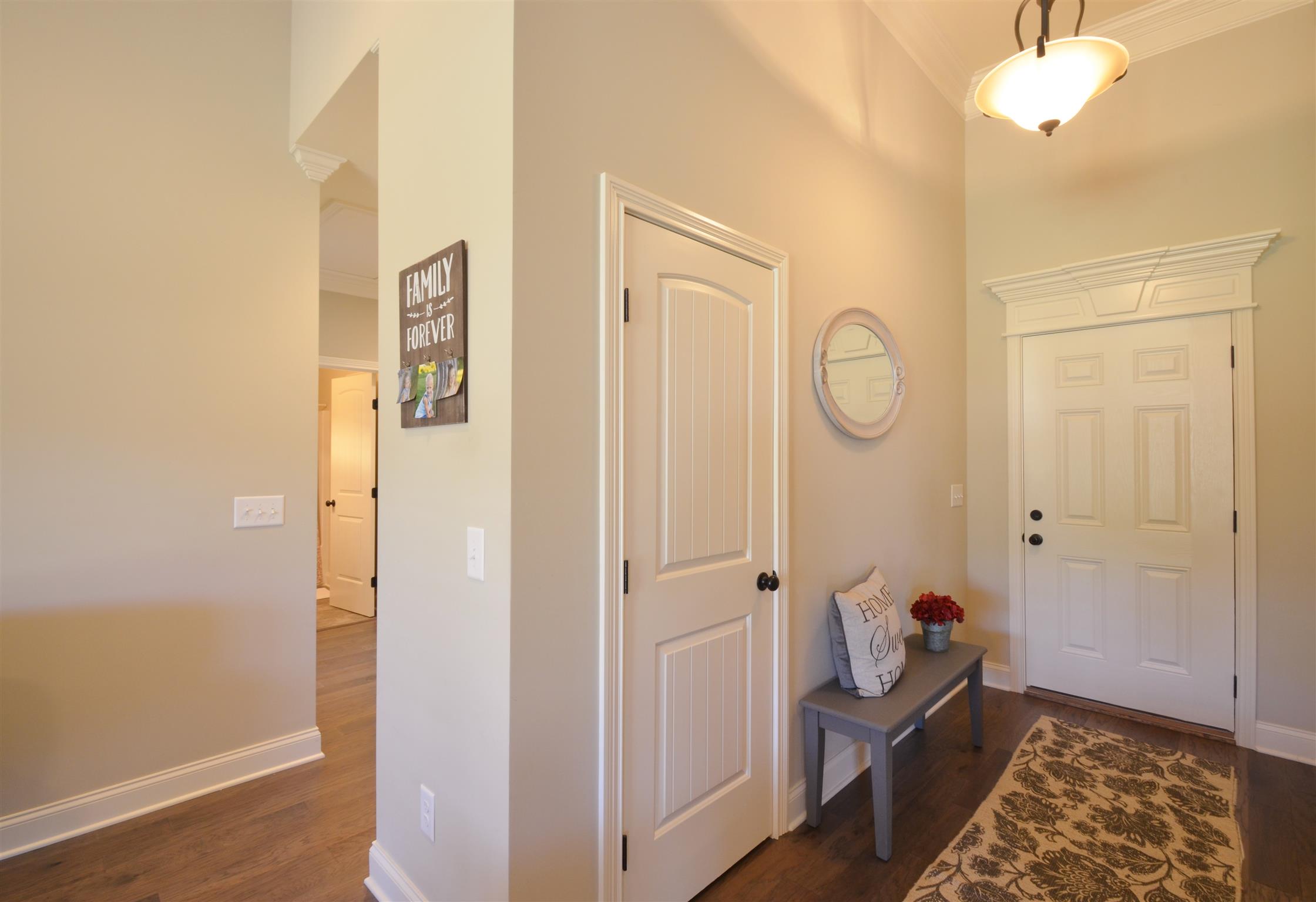 202 Monroe Way Lebanon, TN 37087 - Photo 9 of 26 Gleaming hardwood floors, soaring ceilings and extensive trim throughout the main living areas
