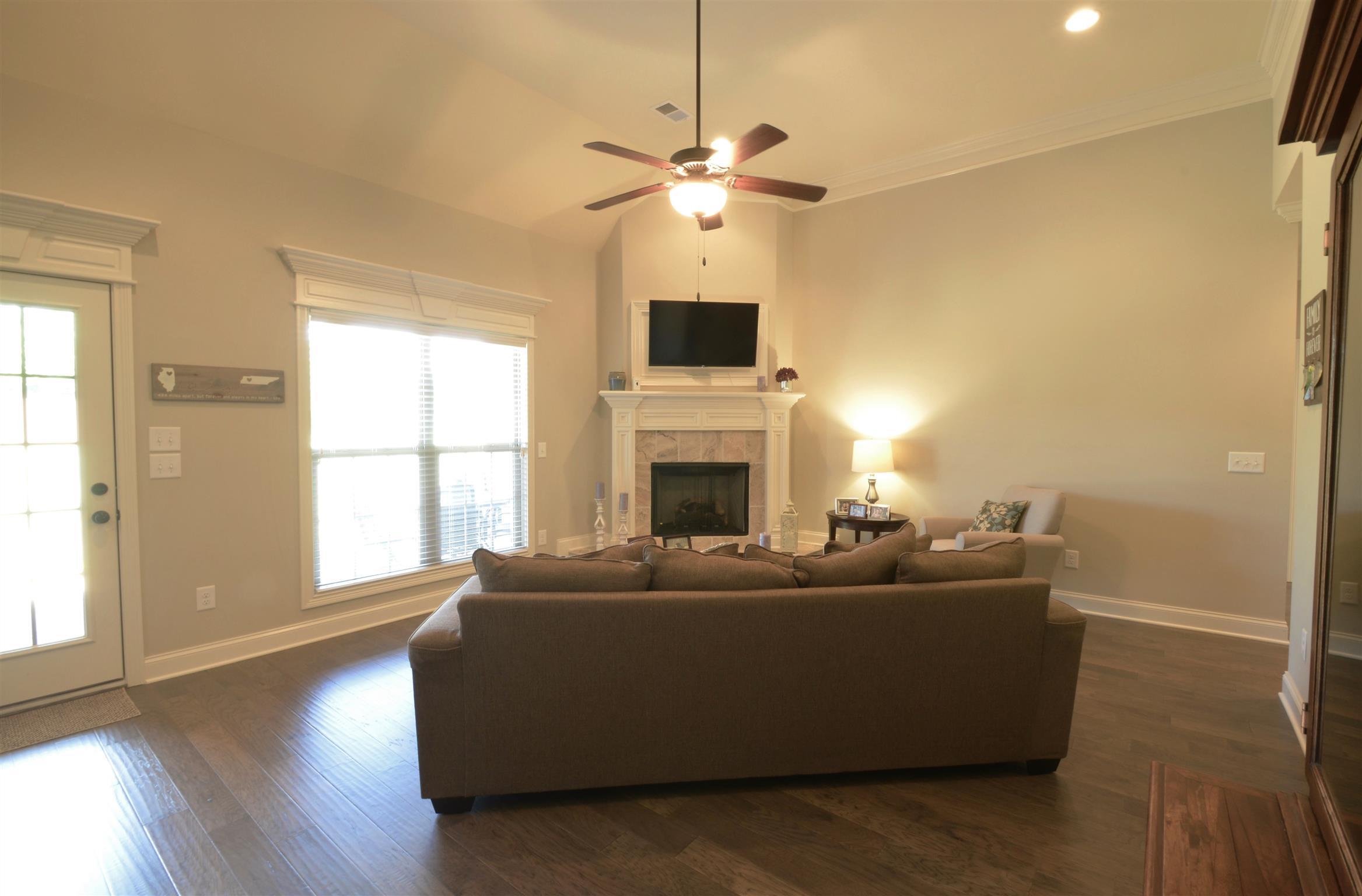202 Monroe Way Lebanon, TN 37087 - Photo 2 of 26 Great Room features soaring ceilings and corner fireplace with a wall mounted TV that remains!