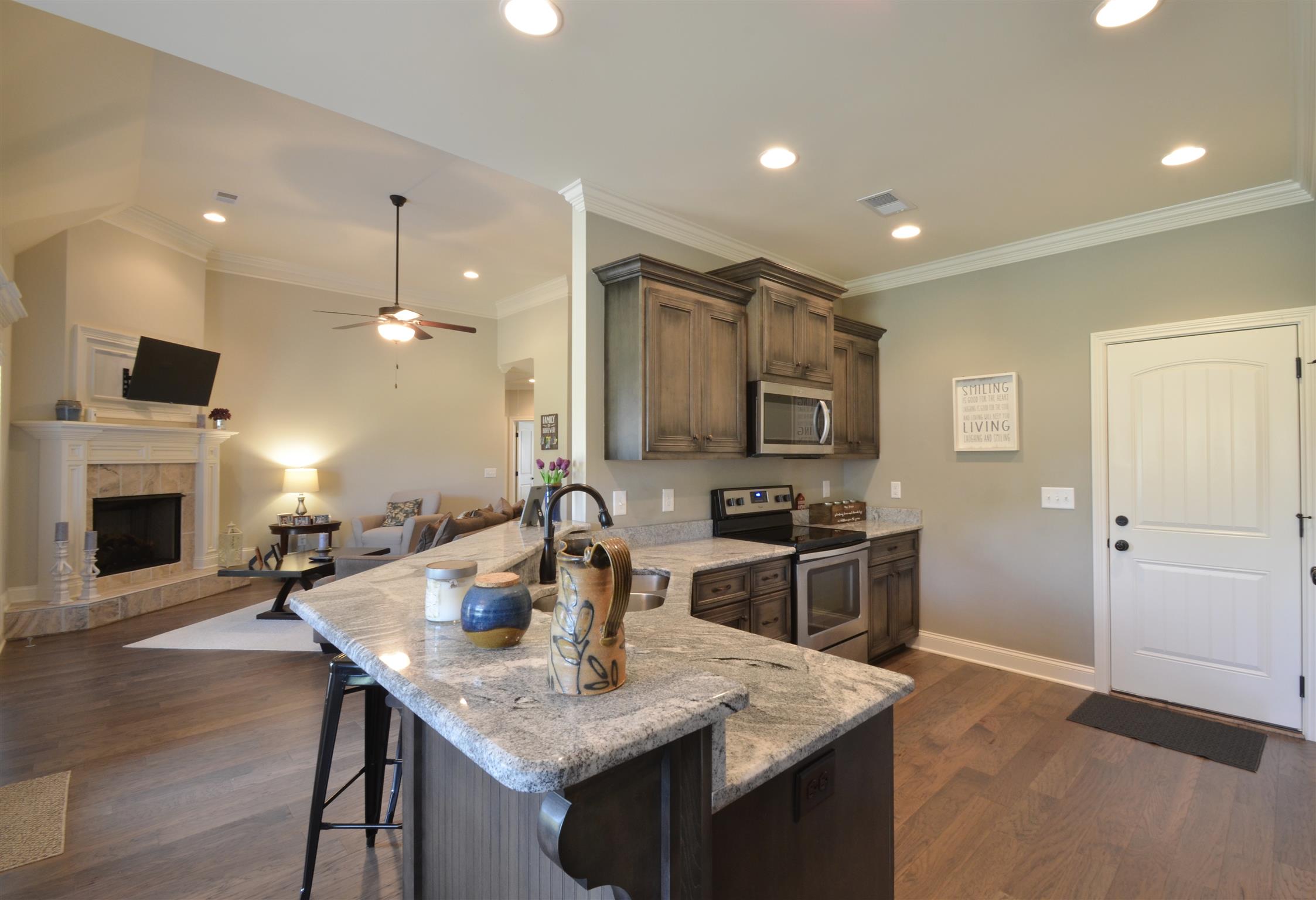 202 Monroe Way Lebanon, TN 37087 - Photo 6 of 26 Cooking is a delight in this gorgeous Kitchen offering stainless appliances, granite, raised eating/serving counter and lots of recessed lighting