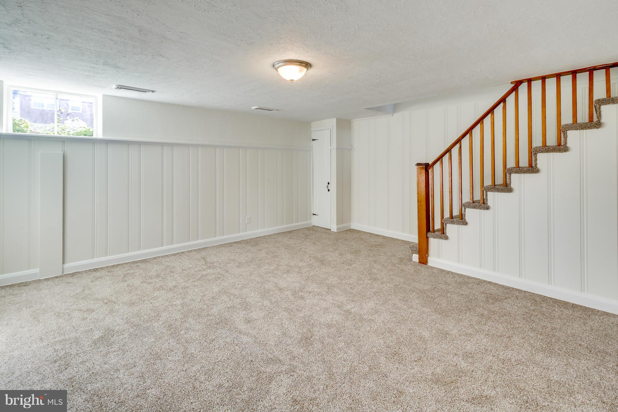 1512 Langford Road Baltimore, MD 21207 - Photo 14 of 30 a view of an empty room with stairs