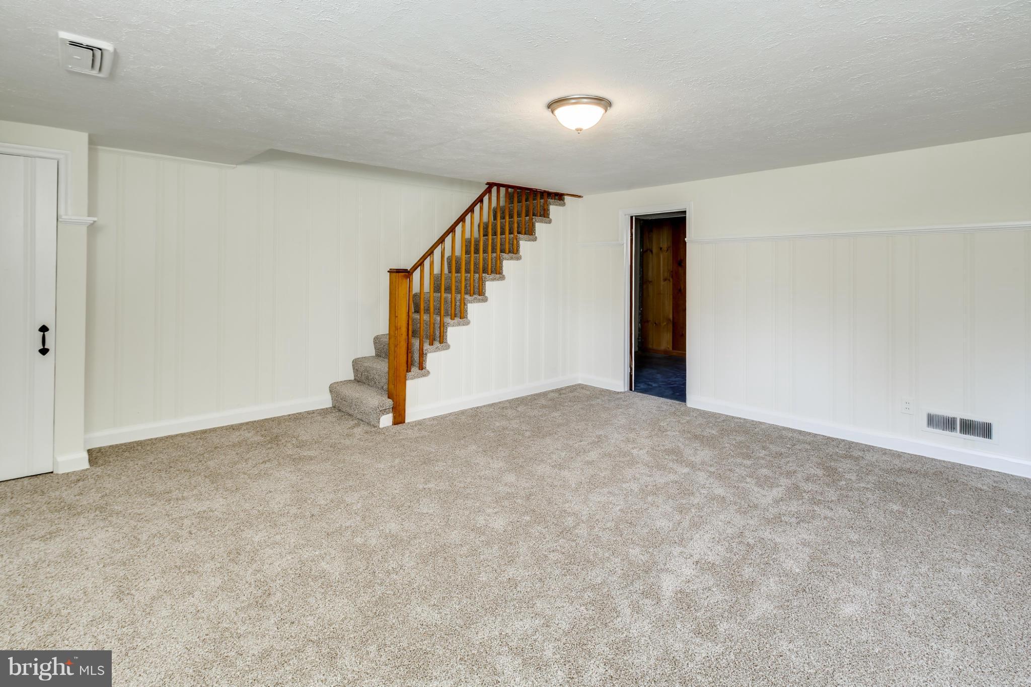 1512 Langford Road Baltimore, MD 21207 - Photo 15 of 30 a view of an empty room with stairs