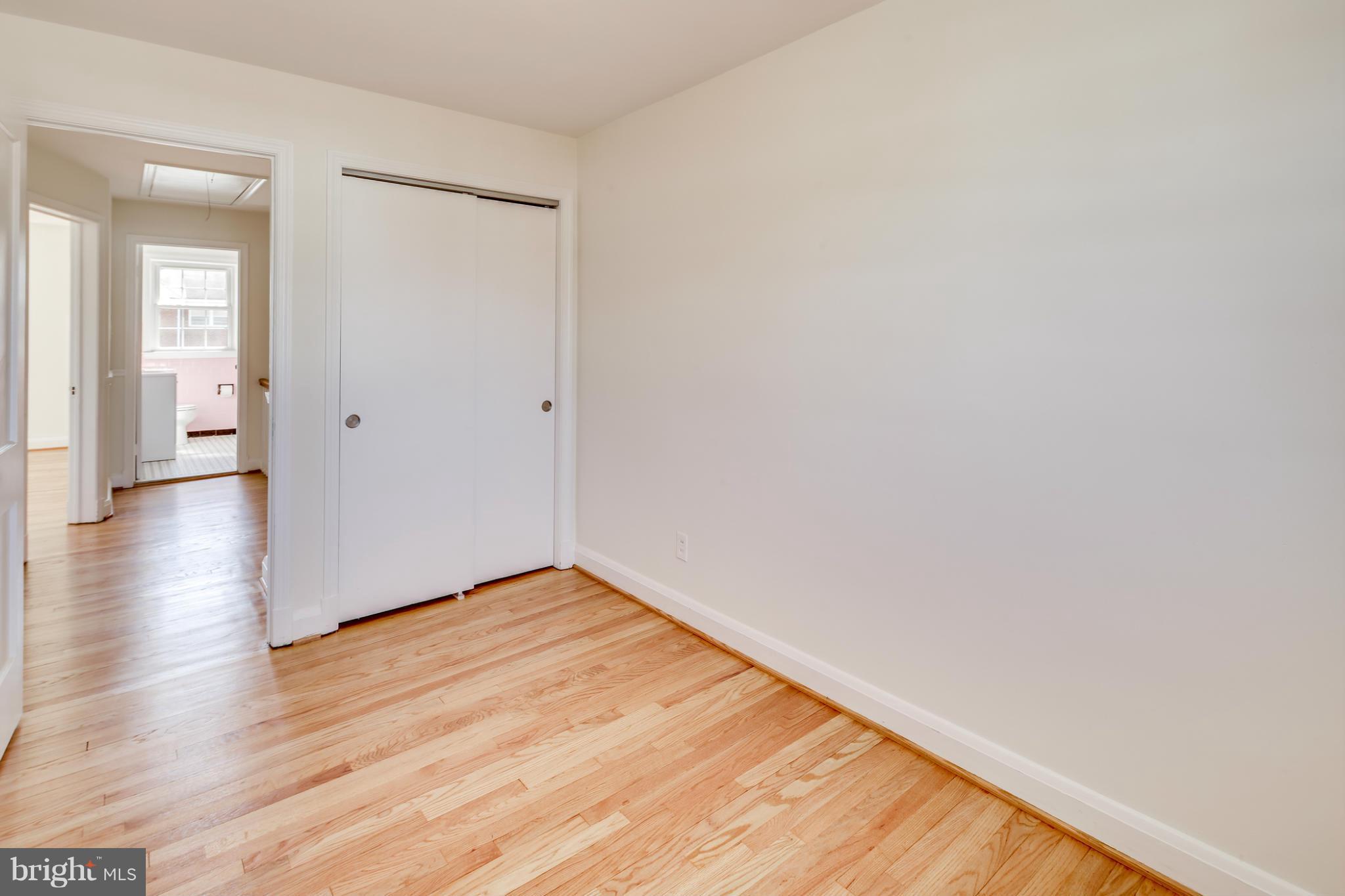 1512 Langford Road Baltimore, MD 21207 - Photo 25 of 30 a view of an empty room with wooden floor