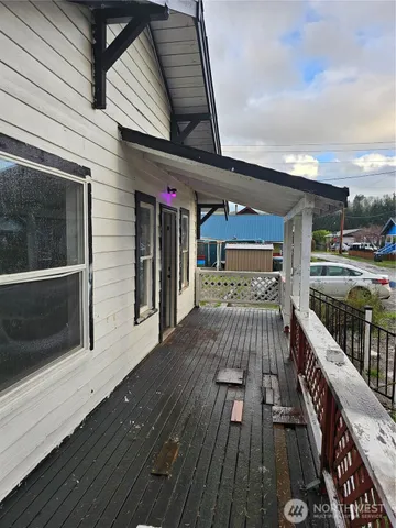 a view of a balcony with wooden floor