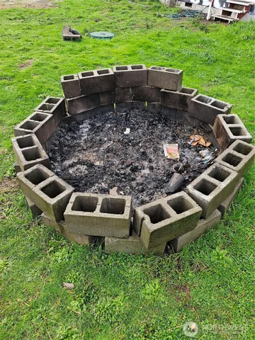 a view of a field with sitting area