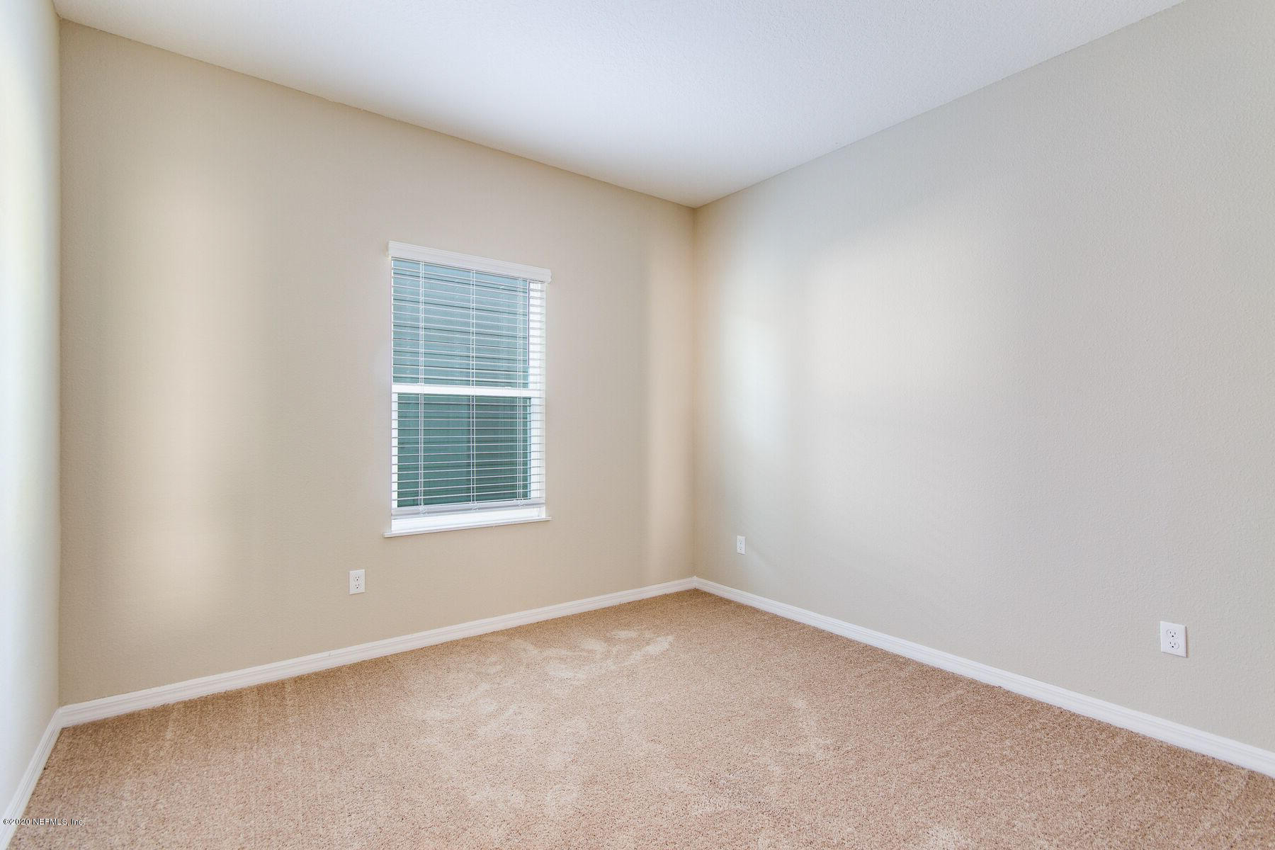98 Tree Frog Way St. Augustine, FL 32095 - Photo 14 of 19 an empty room with a window