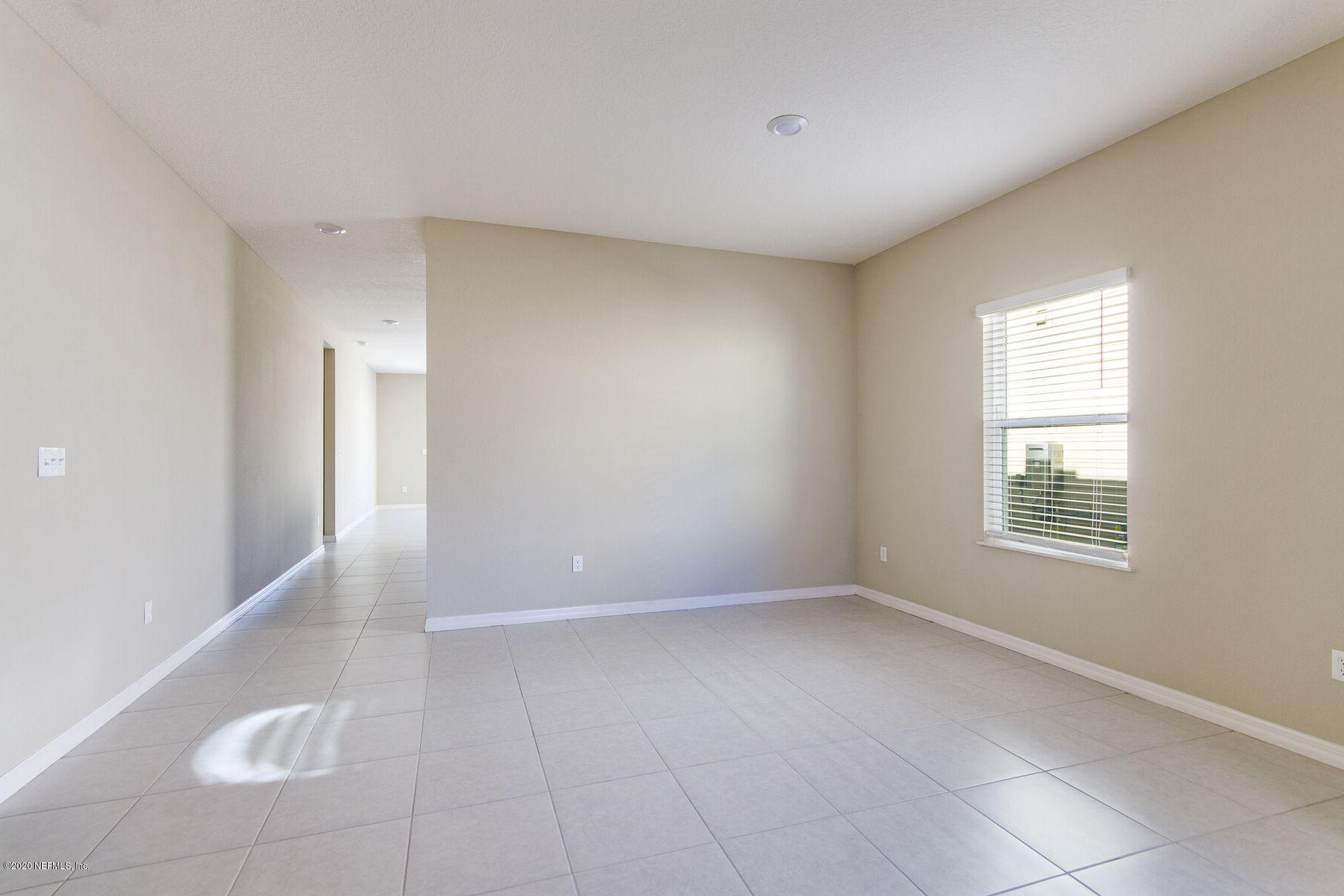 98 Tree Frog Way St. Augustine, FL 32095 - Photo 2 of 19 a view of an empty room with a window