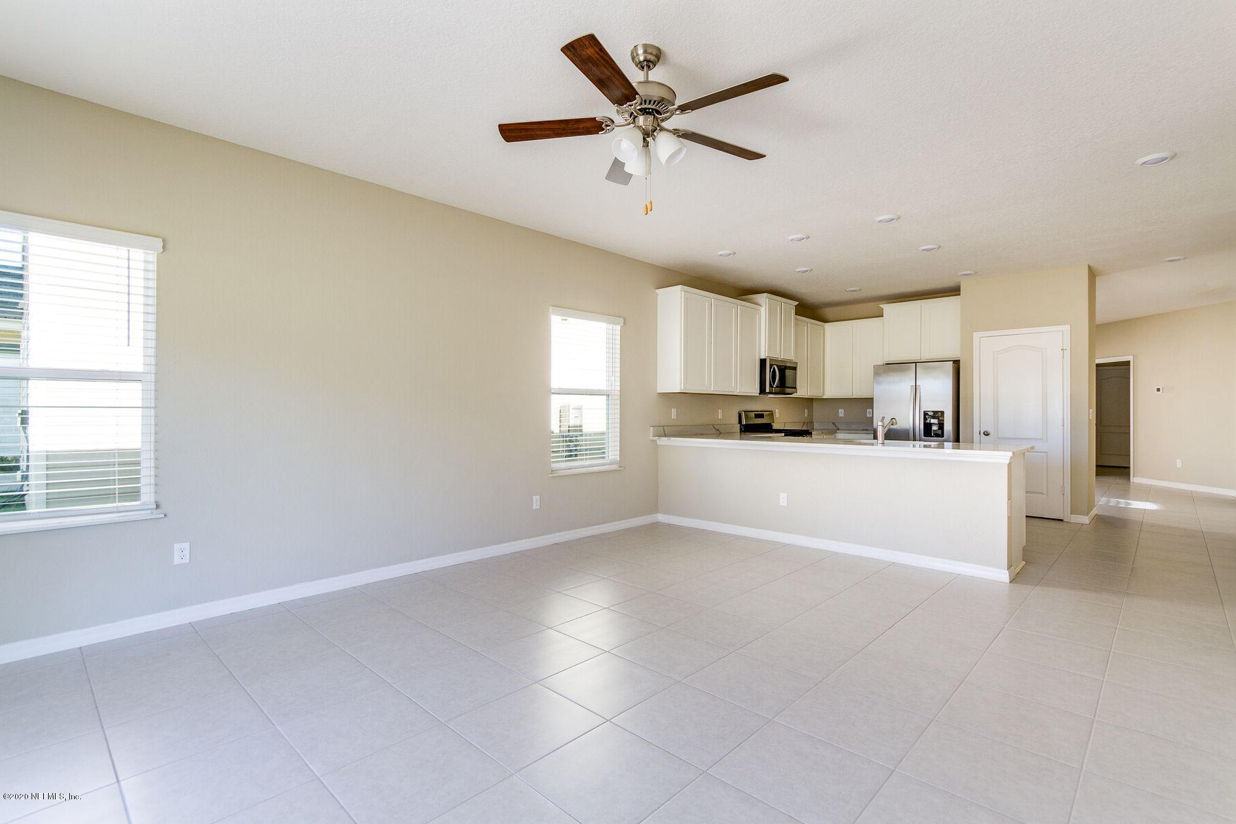 98 Tree Frog Way St. Augustine, FL 32095 - Photo 8 of 19 a view of a kitchen with cabinets stainless steel appliances and a window
