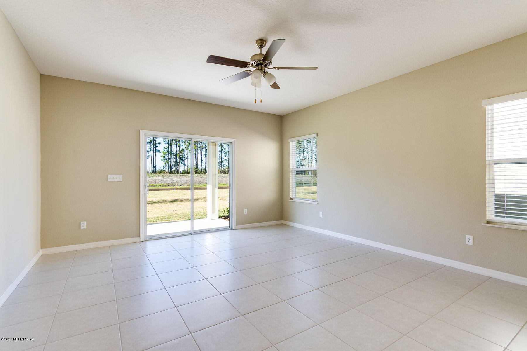 98 Tree Frog Way St. Augustine, FL 32095 - Photo 9 of 19 a view of an empty room with a window