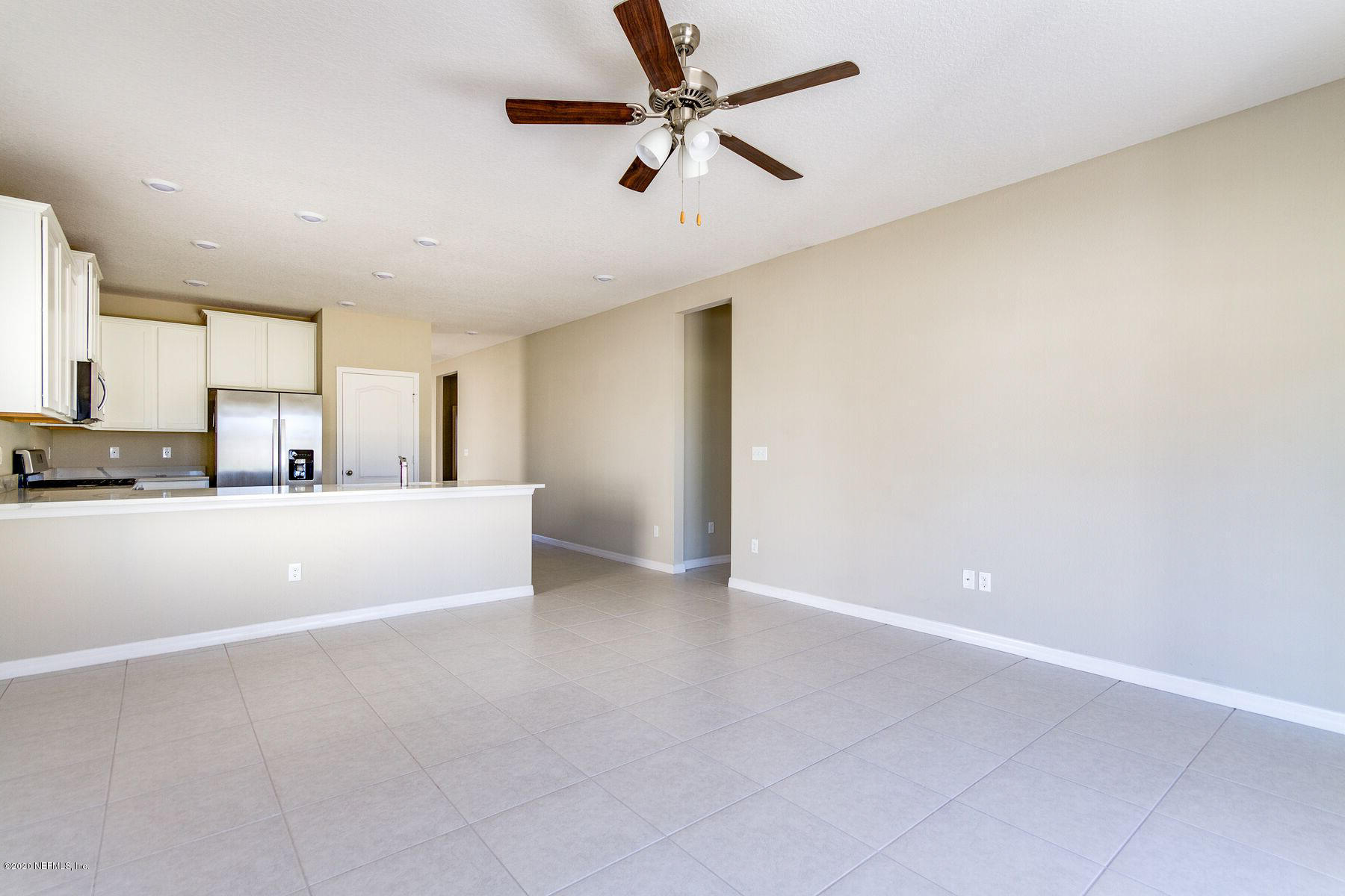 98 Tree Frog Way St. Augustine, FL 32095 - Photo 10 of 19 a view of a kitchen with a sink and cabinet