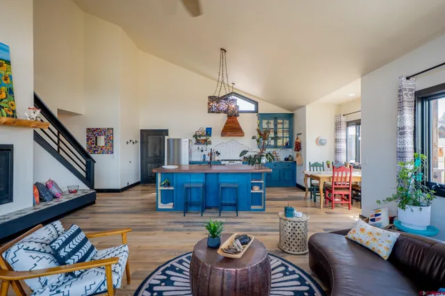 a dining room with furniture and a window