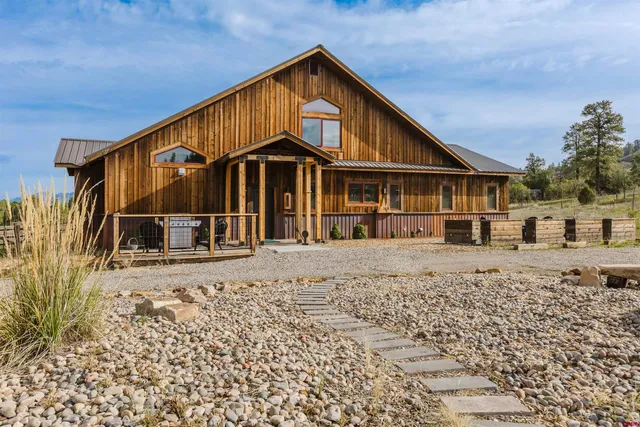 a balcony with table and chairs