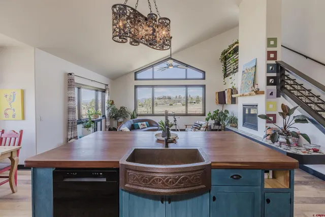 a kitchen with stainless steel appliances granite countertop a stove and cabinets