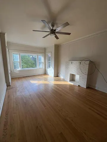 a kitchen with granite countertop wooden floors appliances and sink