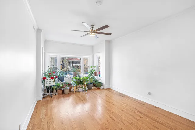 a view of a livingroom with furniture window and wooden floor