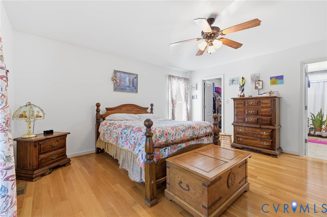 15900 Nobles Road Disputanta, VA 23842 - Photo 19 of 36 Bedroom featuring light hardwood flooring, ceiling