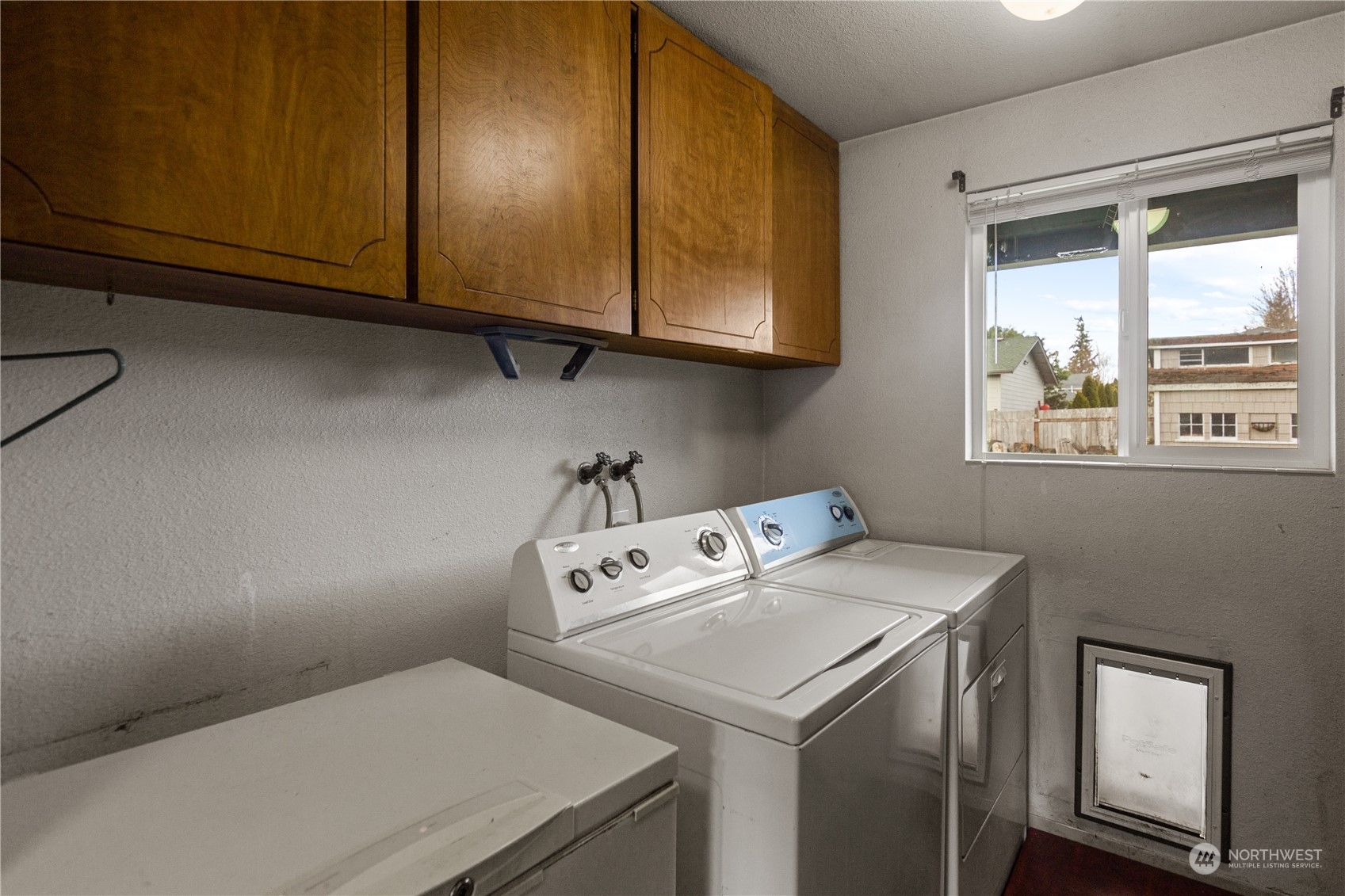 4706 Northeast 18th Street Renton, WA 98059 - Photo 14 of 26 a utility room with dryer and washer