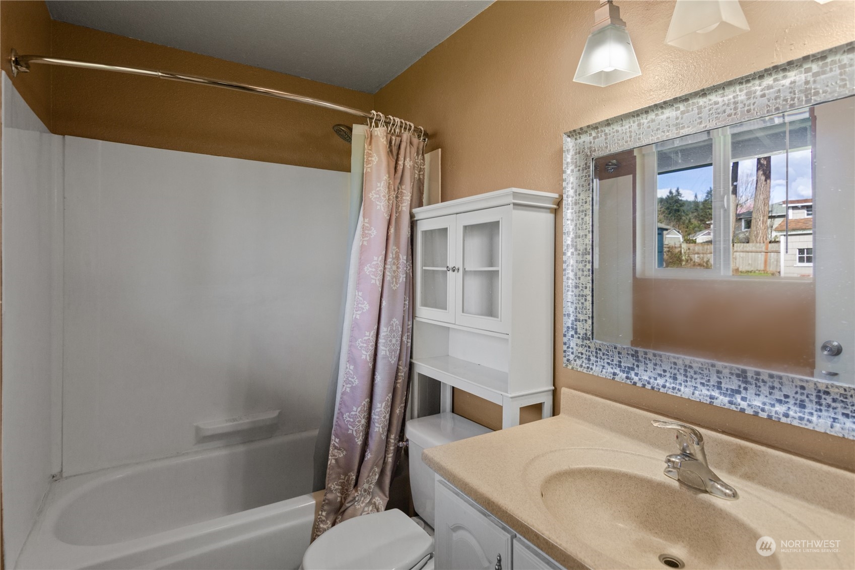 4706 Northeast 18th Street Renton, WA 98059 - Photo 21 of 26 a bathroom with a sink and a mirror