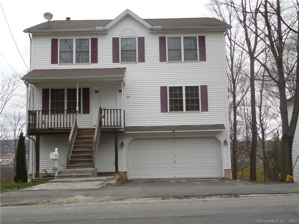 427 Wilson Street Waterbury, CT 06708 - Photo 1 of 1 a front view of a house with a garage