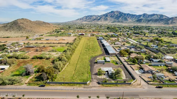 an aerial view of residential houses with outdoor space
