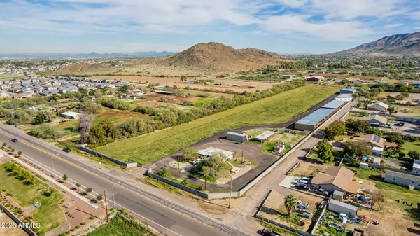 an aerial view of a residential houses with outdoor space