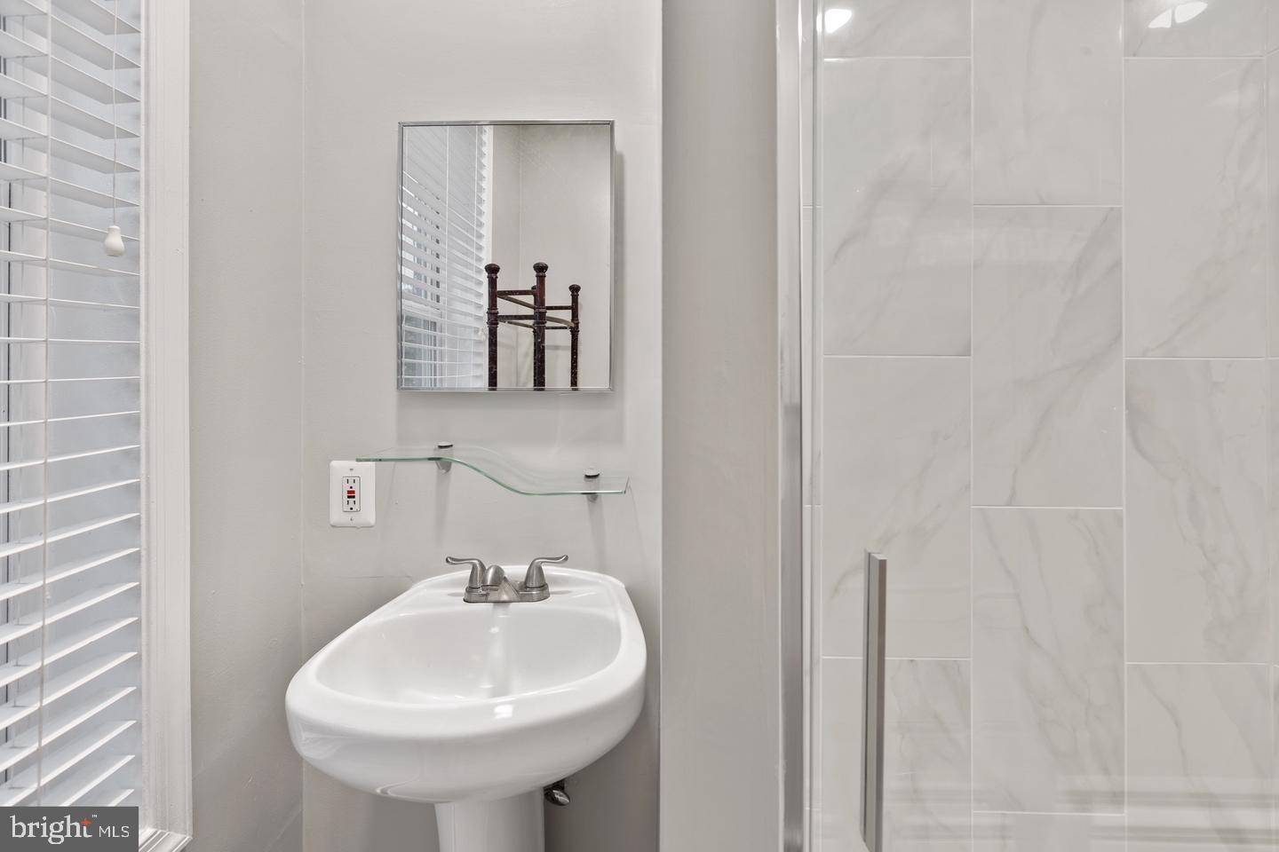225 14th Place Northeast Washington, DC 20002 - Photo 13 of 20 Sleek bathroom with modern finishes.