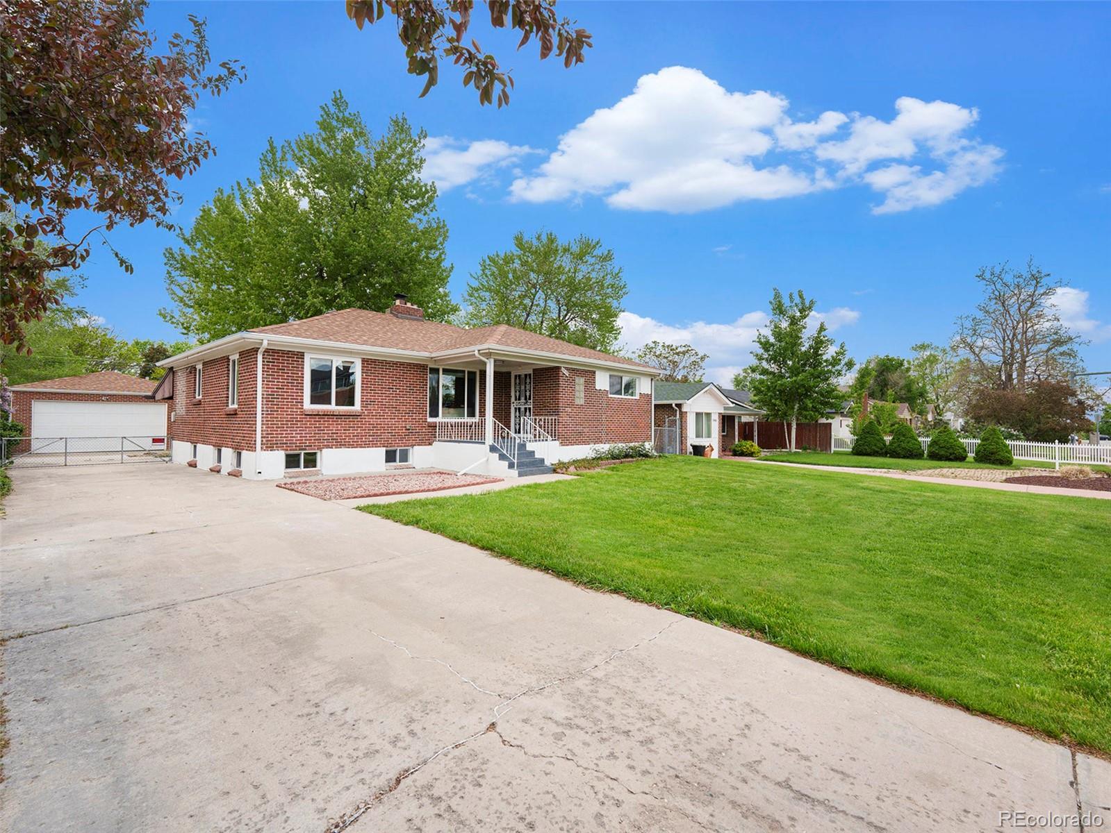 3895 Pierce Street Wheat Ridge, CO 80033 - Photo 1 of 33 a view of a house with a swimming pool