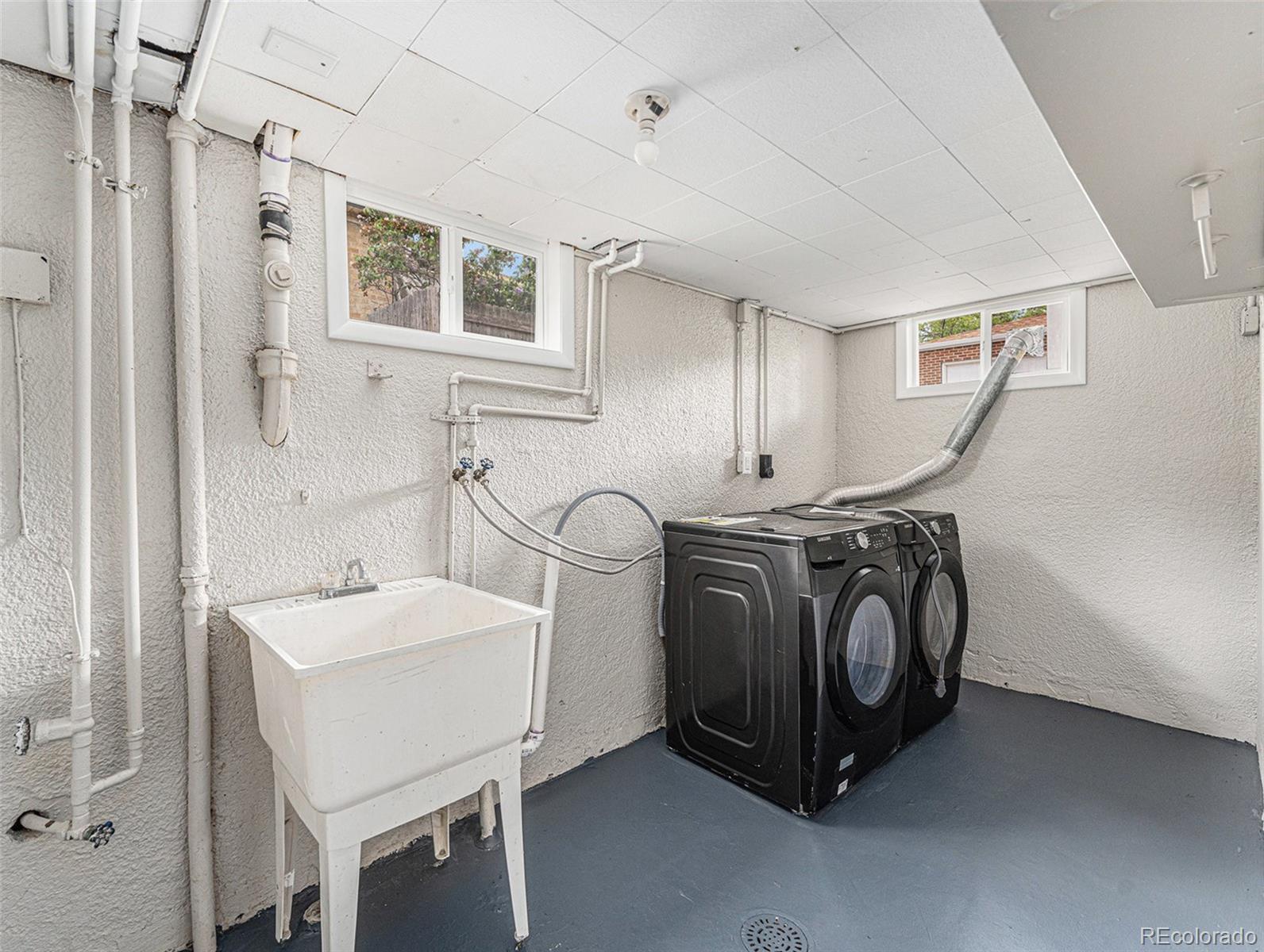3895 Pierce Street Wheat Ridge, CO 80033 - Photo 20 of 33 a utility room with dryer and washer