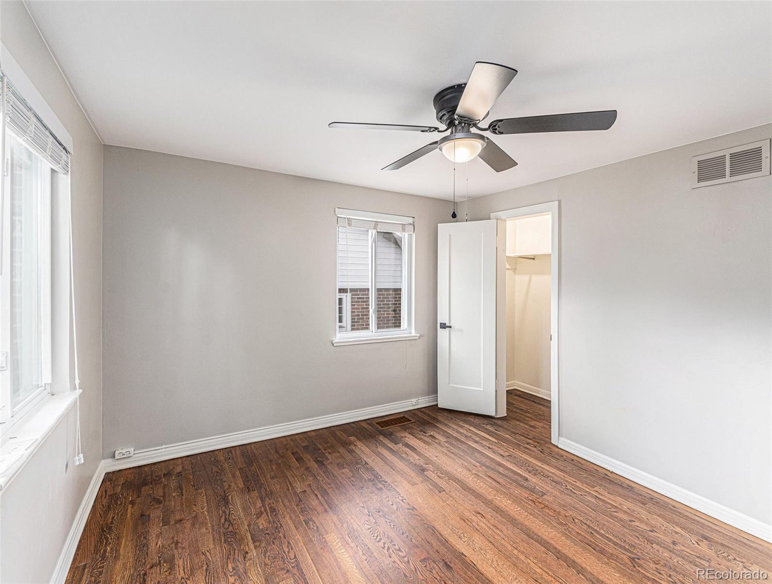 3895 Pierce Street Wheat Ridge, CO 80033 - Photo 21 of 33 a view of empty room with wooden floor and fan