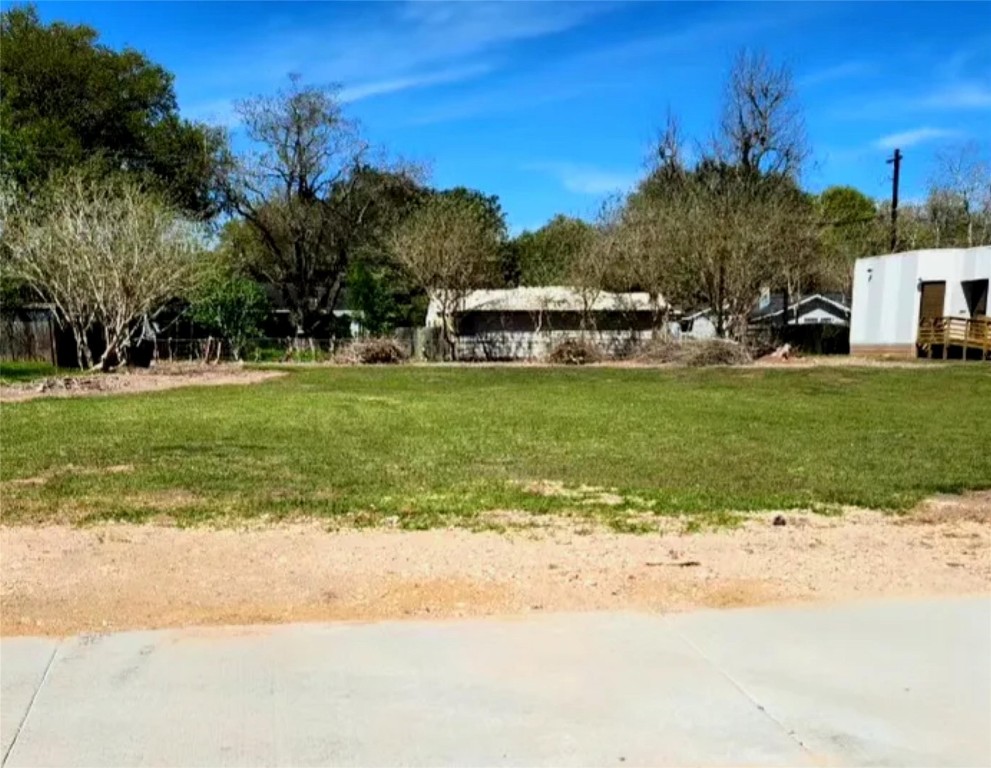 1323 North Alabama Road Wharton, TX 77488 - Photo 2 of 3 a front view of a house with a yard and trees