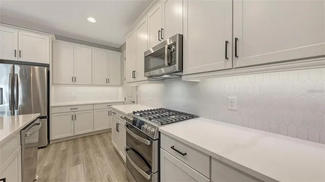 a dining room with furniture window and wooden floor