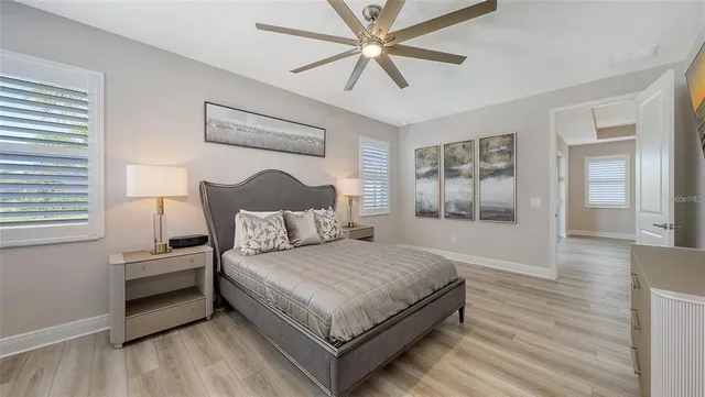 a bedroom with a large bed and a window