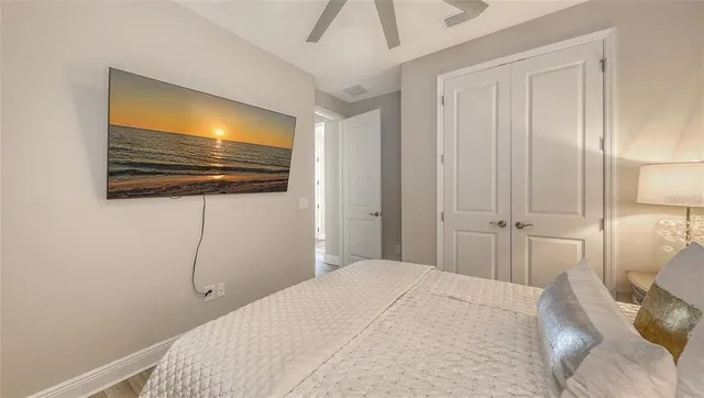 a view of a house with a yard and potted plants